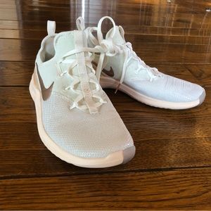 Nike Free rose gold, sparkly white training tennis shoes.